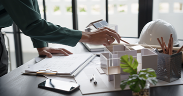 Image of someone working at a desk