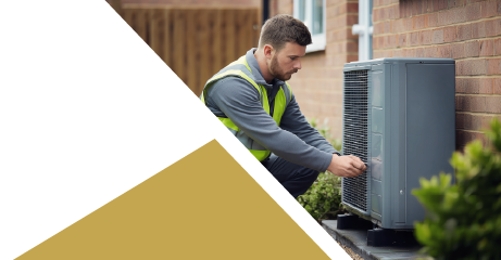 Image of someone working on a heat pump
